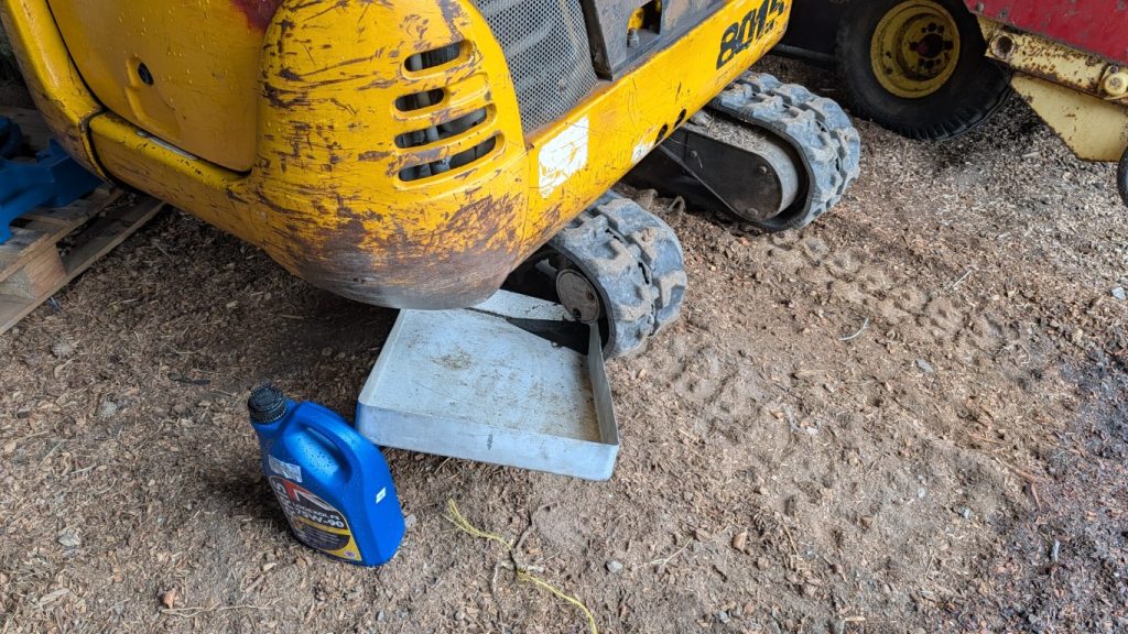 Changing the mini digger track motor oil was surprisingly straightforward.