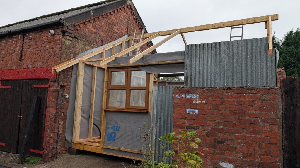 After the window came down, the ridge beam could be relocated.