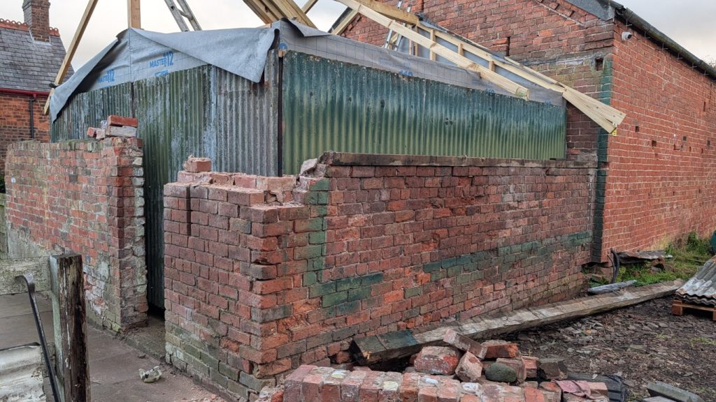 Bang, crash, whollop, and amazing —the wall is still standing.