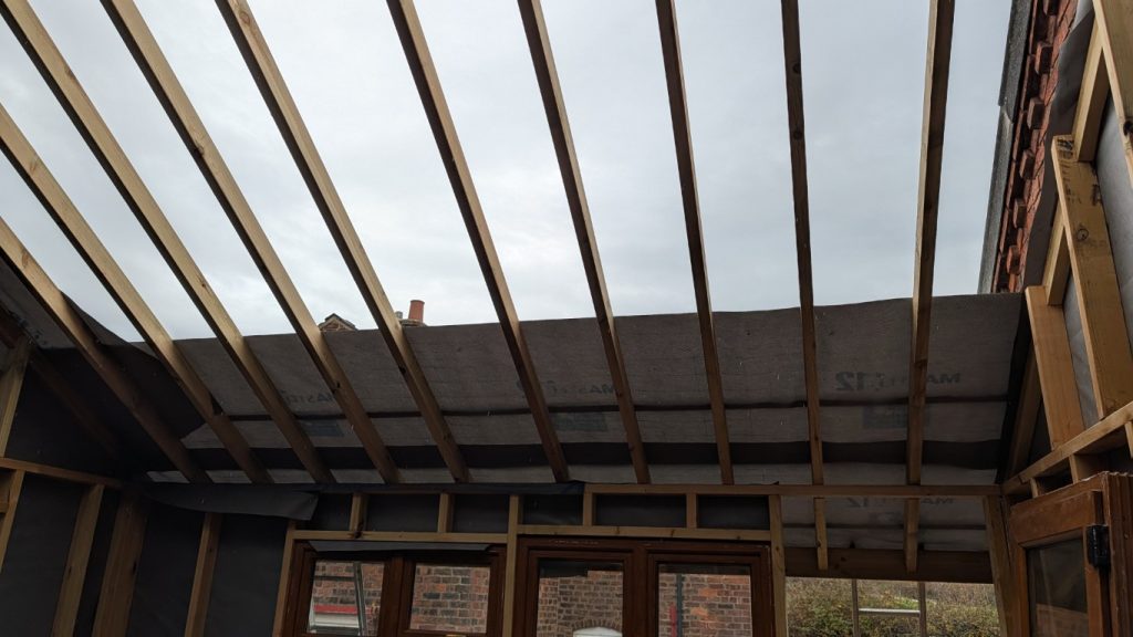 Onto the front roof membrane.