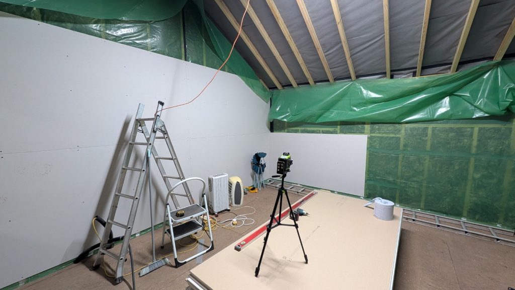 The laser level compensates for the natural bends in a timber frame.