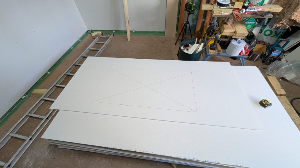 Careful measurement and the windows are marked up on the plasterboard.